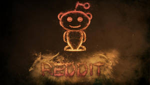 發光的 Reddit 外星人標誌由灰塵製成，下方有「REDDIT」文字，深色背景。