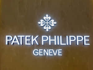Patek Philippe Geneve 奢華手錶品牌標誌於青銅牆上。