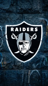 Raiders 標誌在裂開的石牆上，帶有塗鴉。 — 掠奪者 壁紙