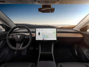 Tesla 汽車內部顯示導航屏幕和日落沙漠景色。 — Tesla GIF 壁紙