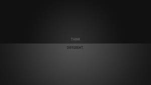 深灰色漸變背景，白色文字 THINK DIFFERENT 居中顯示。 — 桌面美學 壁紙