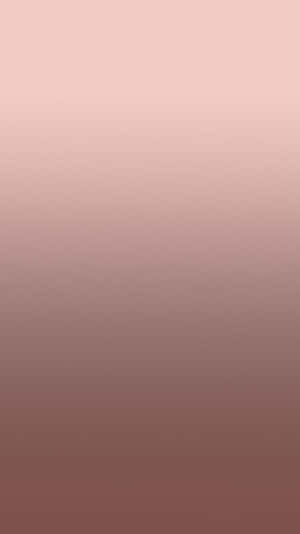 從粉紅色到紫紅色的柔和漸變，適合平靜的背景。 — 玫瑰金 iPhone 壁紙