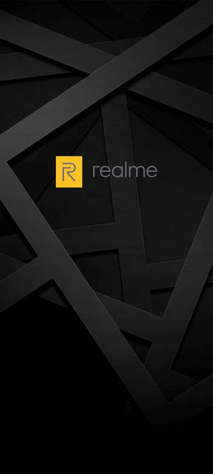 黑色幾何牆紙，中間有黃色realme標誌。