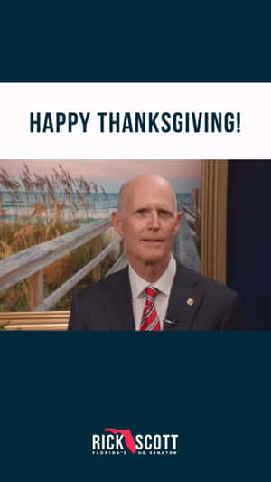 參議員 Rick Scott 身穿西裝微笑，背景為海灘日落和感恩節祝福。
