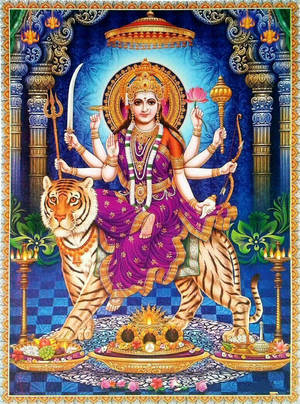 印度教女神杜爾迦（Durga）有十臂騎著老虎，手持武器和蓮花。