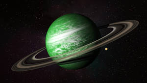 深空中被星星環繞的帶有光環的綠色行星