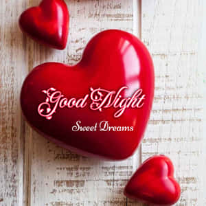 木質表面上的三顆紅色心形及good night sweet dreams文字 — 插畫 壁紙