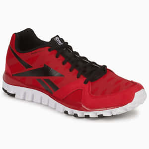 帶有黑色鞋帶和白色鞋底的紅色Reebok跑鞋。 — 1:1 壁紙