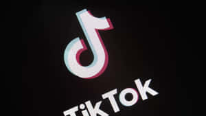 TikTok 標誌在黑色背景上發出青色和洋紅色的光芒