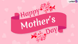 Happy Mother's Day 橫幅，帶有粉紅色絲帶和花卉裝飾，背景為心形圖案。 — 螢幕保護 壁紙