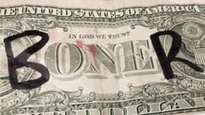 一張被塗鴉上「BONER」一詞的美元鈔票。