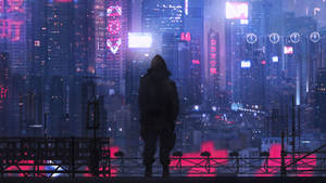 一個人的剪影在夜晚俯瞰著發光的未來城市。