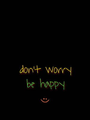 霓虹發光文字寫著 don't worry be happy，並帶有笑臉。