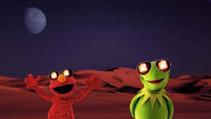 Elmo 和青蛙 Kermit 戴著太陽眼鏡，在紅色沙漠上，天空中有死星。