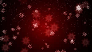 雪花在紅色漸變背景上發光，帶有散景效果。 — 美麗聖誕 壁紙
