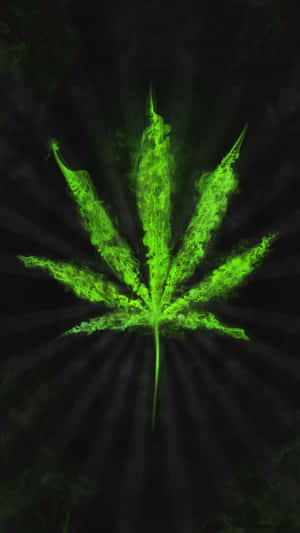 在黑暗背景上帶有煙霧效果的發光綠色大麻葉。 — 星際寶貝 壁紙