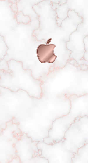 玫瑰金色 Apple 標誌在帶有粉紅色紋理的白色大理石上。