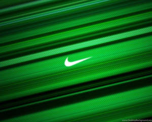 白色Nike勾號在綠色紋理布料上，帶有動態模糊條紋。 — 綠色動態圖 壁紙