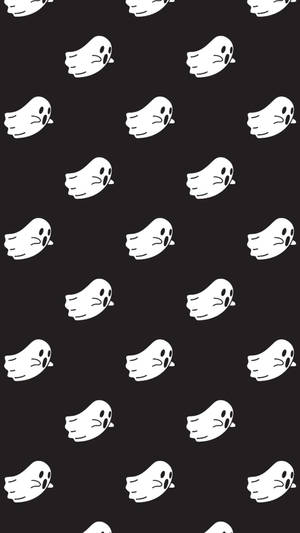 黑色背景上重複的白色卡通鬼魂在眨眼 — 拼貼 GIF 壁紙