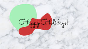 在大理石紋理上帶有紅色和綠色形狀的Happy Holidays訊息。