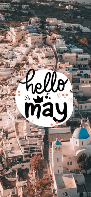 白色村莊，藍色圓頂，hello may 文字疊加 — iPhone 15 Plus 壁紙
