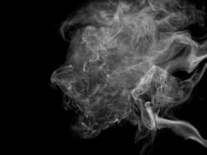 白色煙霧在黑色背景上動態旋轉。 — 煙霧動畫 壁紙