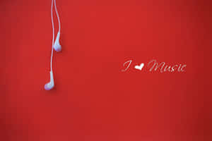 紅色背景上的白色耳機和「I ♥ Music」文字。 — 音樂美學 壁紙