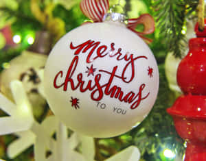 白色聖誕裝飾，紅色文字寫著 Merry Christmas to You。