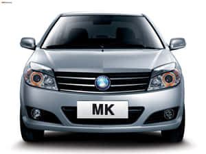 帶有橙色飾邊頭燈和「MK」車牌的銀色轎車。 — 酷車 壁紙
