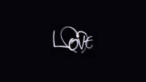 黑色背景上發光白色手寫字 love