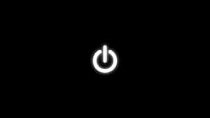 一個發光的白色電源按鈕圖示，位於黑色背景上。