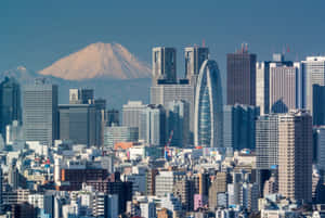 晴朗日子裡，東京天際線與背景的富士山。 — MacBook Pro 14 壁紙