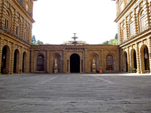 陽光普照的石砌庭院，拱形走道和中央噴泉。 — 建築 壁紙