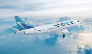 西捷航空飛機在藍天白雲上飛行