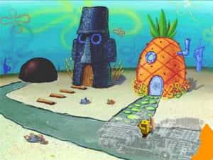 SpongeBob 的菠蘿屋旁邊有一個石臉雕像在水下。