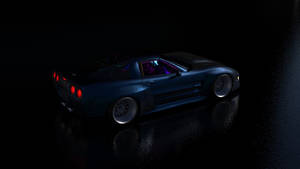 夜間在潮濕路面上發光的藍色跑車。