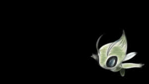 一條發光綠色大眼藍魚在黑暗中游動。