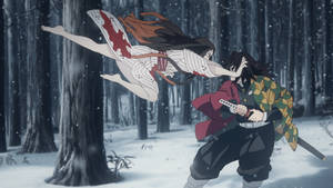 武士在雪地森林中與幽靈女子戰鬥的動漫場景 — 鬼滅之刃 壁紙