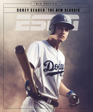身穿道奇隊球衣的棒球選手 Corey Seager 在攝影棚肖像中手持球棒。
