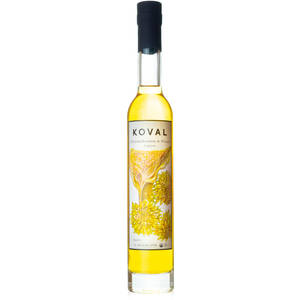 一瓶帶有黃色花卉設計的Koval Chrysanthemum & Honey Liqueur。