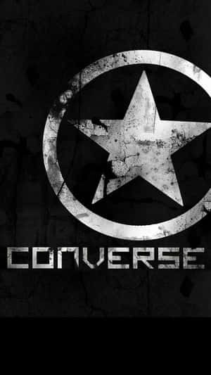 Converse標誌，帶有星星和圓圈，背景為裂開的混凝土。 — AMOLED 壁紙