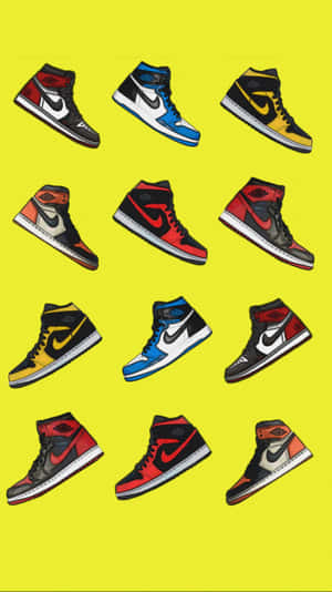 十雙不同配色的Air Jordan 1運動鞋在黃色背景上以網格排列。