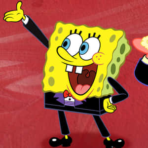 穿著燕尾服的SpongeBob帶著喜悅的表情豎起大拇指。 — 卡通 壁紙