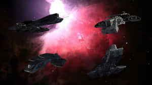 四艘未來風格的軍艦在深空中穿梭於色彩繽紛的星雲。