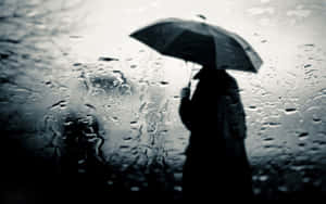 雨中室內撐傘的人影剪影