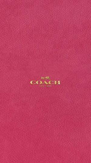 粉紅色皮革Coach手袋，金色標誌