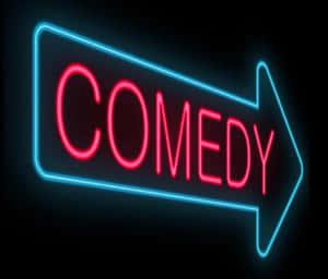霓虹燈牌寫著 comedy，藍色邊框和紅色字母，指向右方。 — 笑緊 壁紙