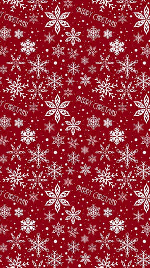 紅色背景，帶有白色雪花和Merry Christmas文字。 — 主畫面 壁紙
