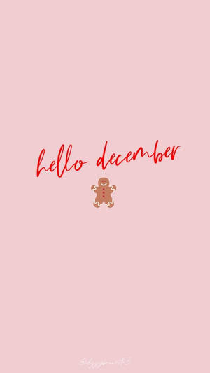 粉紅色背景，上面有紅色hello december文字和一個薑餅人。