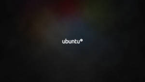 深色紋理背景上的 Ubuntu 標誌，帶有柔和彩虹模糊效果。